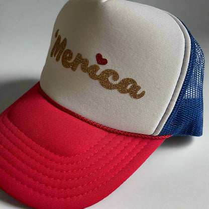 Cap with 'Merica text and heart on beige, red, and blue mesh design.